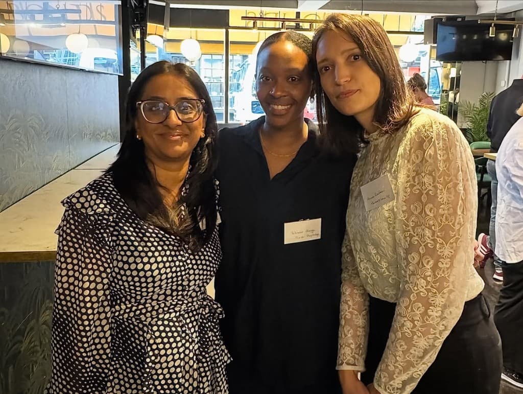 Team members at a professional networking breakfast